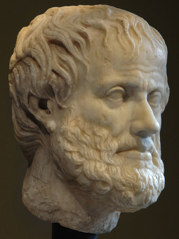 A stone rendition of the bearded head of Aristotle.