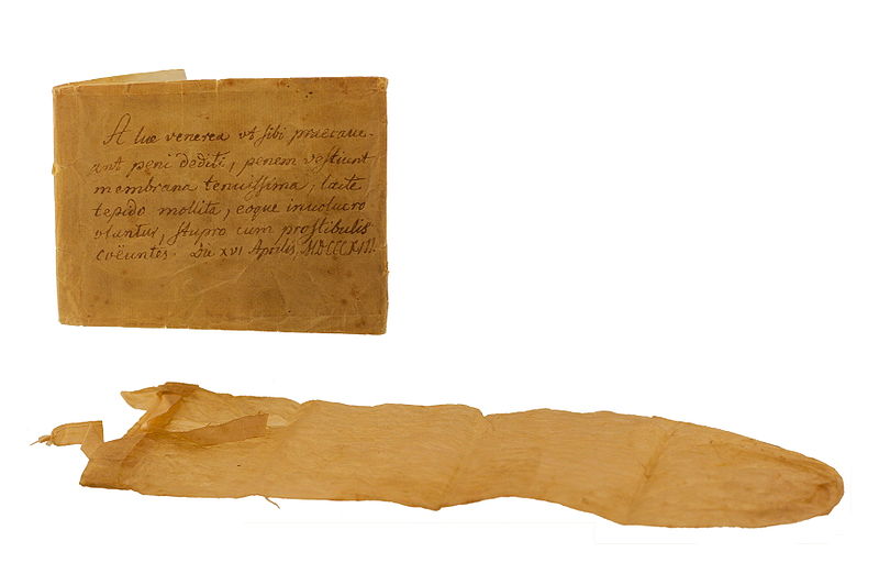A condom from 1813 with a handwritten manual placed behind it.